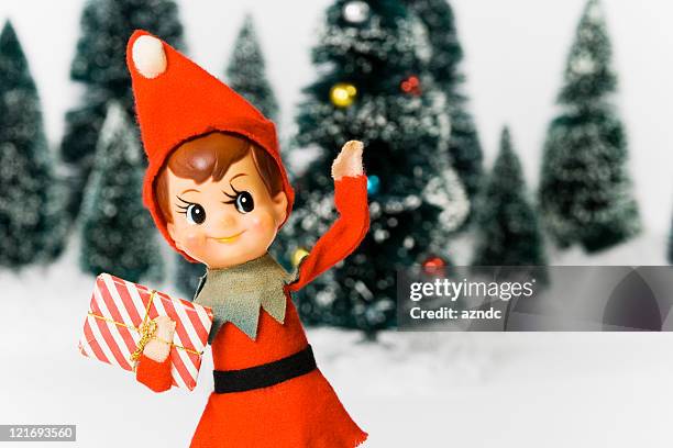 vintage christmas elf toy arranged with fur trees and snow - christmas tree 50's stock pictures, royalty-free photos & images