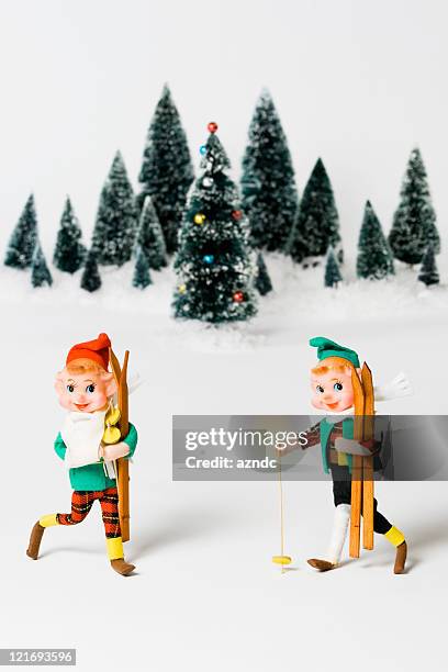 vintage elf figurines on with snow christmas scenario - christmas tree 50's stock pictures, royalty-free photos & images