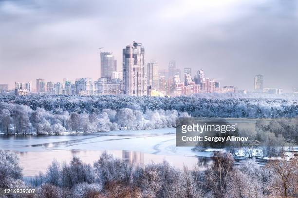 aerial view of white snowy moscow in winter season - russia city stock pictures, royalty-free photos & images