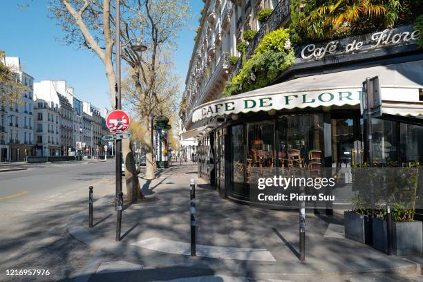 View of the Cafe De Flore int he St Germain district on April 05, 2020 in Paris, France. The country is issuing fines for people caught violating its...