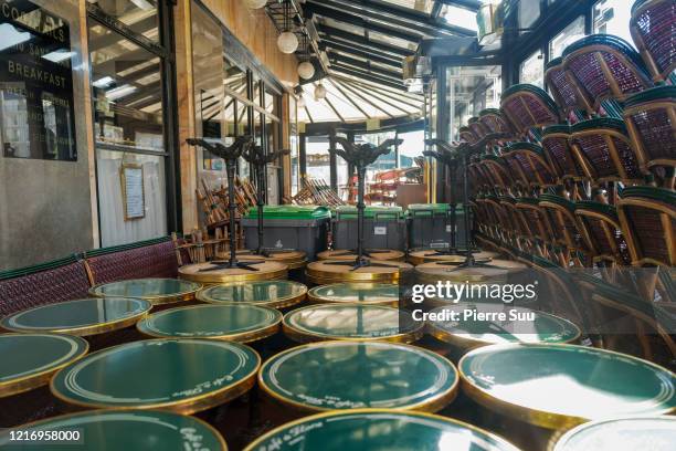 View of the Cafe De Flore int he St Germain district on April 05, 2020 in Paris, France. The country is issuing fines for people caught violating its...