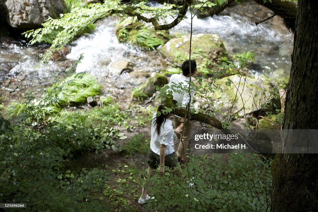 Man and woman who has a saunter in the woods