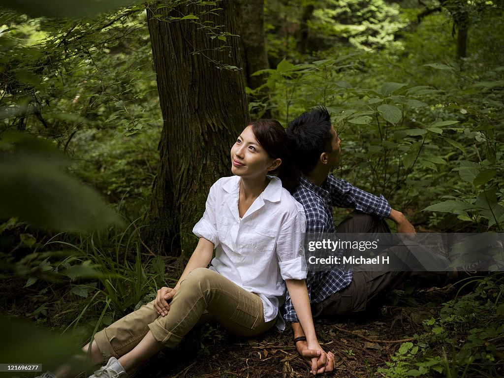Lovers who draws close happily in forest