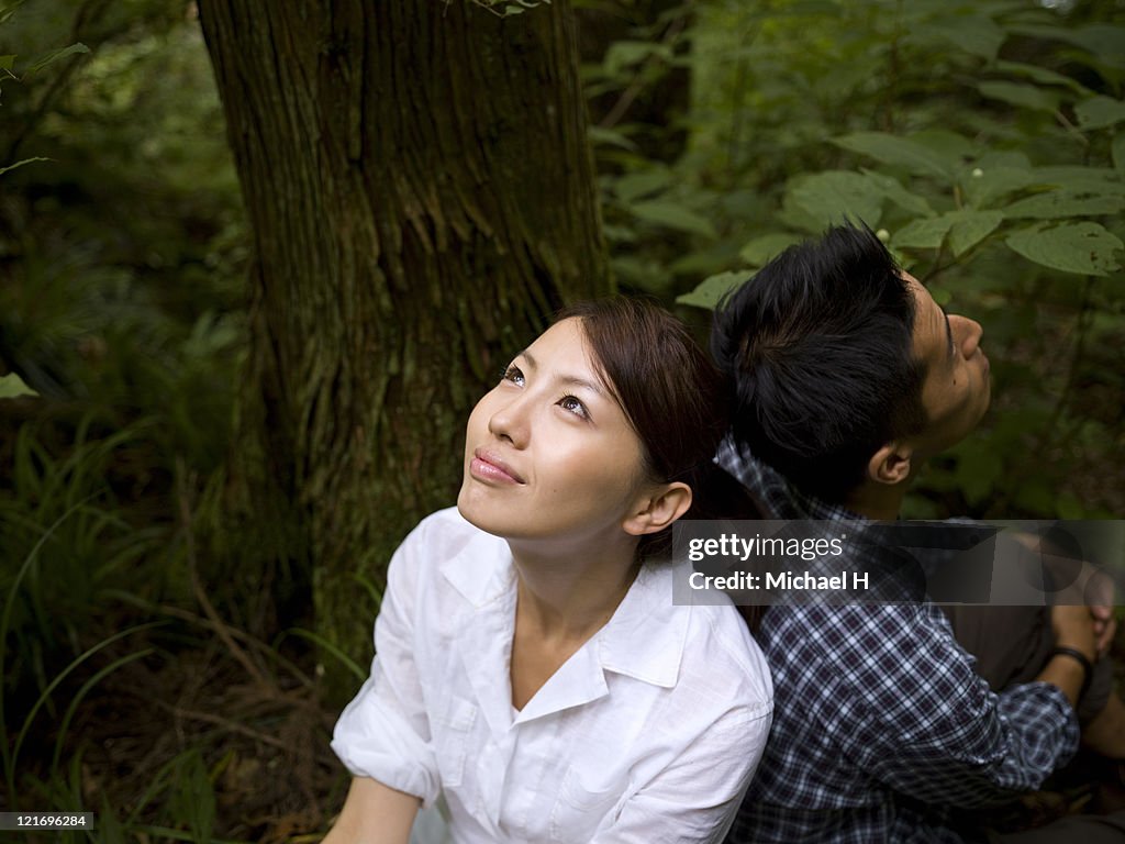 Lovers who draws close happily in forest