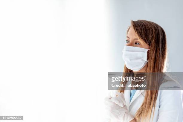 doctor female praying - nurse praying stock pictures, royalty-free photos & images