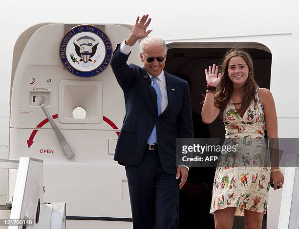 Vice President Joe Biden and his granddaughter Naomi Biden walk out from Air Force Two upon arrival at the Chinggis Khaan International Airport in...