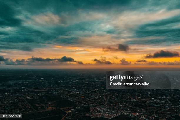 dramatic sunset in luanda, talatona. - jungle scene stockfoto's en -beelden