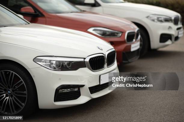 bmw motor vehicles for sale at dealership - luxury cars show stock pictures, royalty-free photos & images