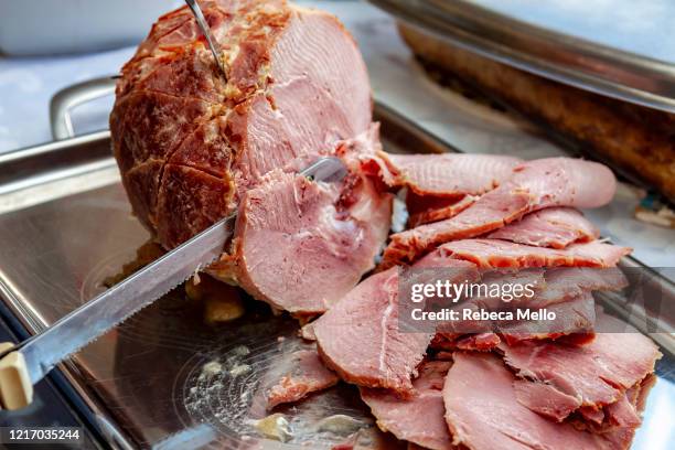 slicing roasted ham - ham stock pictures, royalty-free photos & images