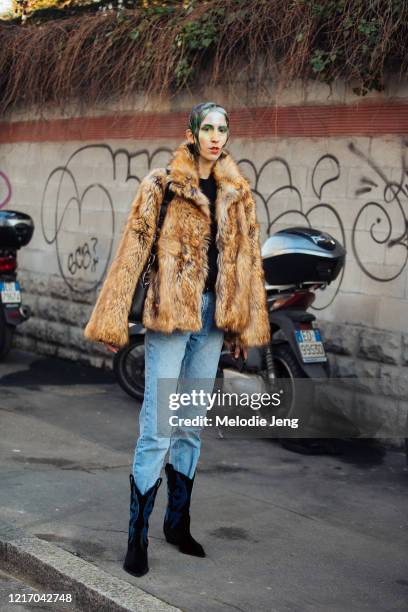 Model Sveva Miserotti wears a brown fur jacket, blue jeans, and black suede cowboy boots after the Marni show during Milan Fashion Week Fall/Winter...