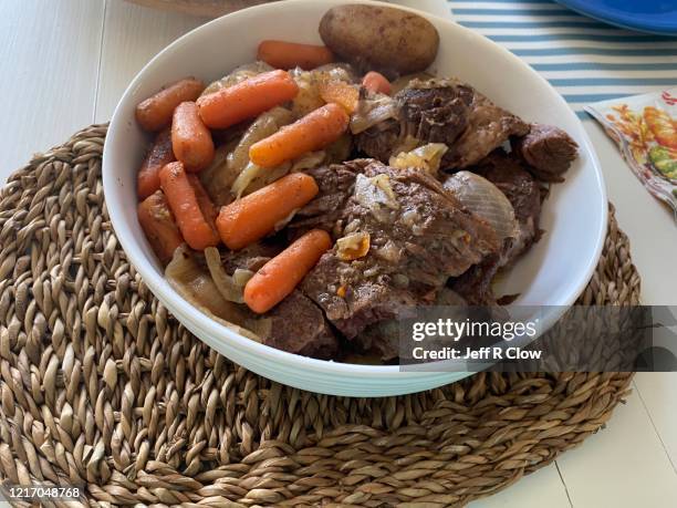 homemade pot roast with cooked carrots - schmorbraten stock-fotos und bilder