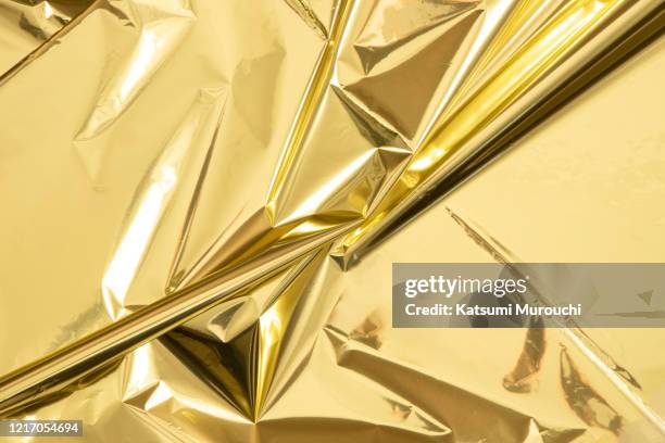 Gold Rapping Paper 514 Gold Foil Wrapping Paper Stock Photos, High-Res Pictures, and ...