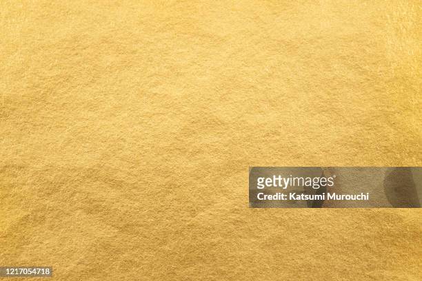 metalic gold foil paper texture background - gold coloured stock pictures, royalty-free photos & images
