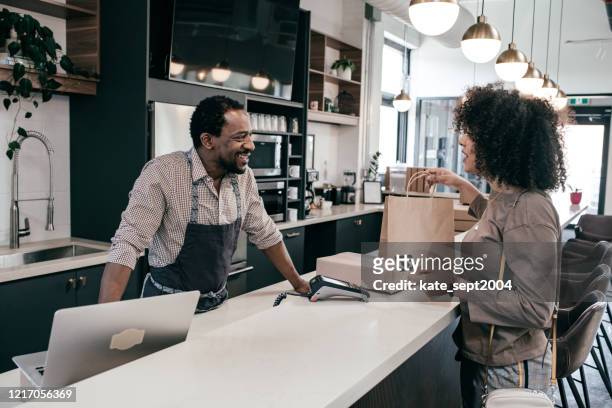 customer at retail store - debit cards credit cards accepted stock pictures, royalty-free photos & images