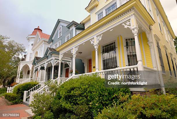 brightly colored row houses - savannah georgia stock pictures, royalty-free photos & images