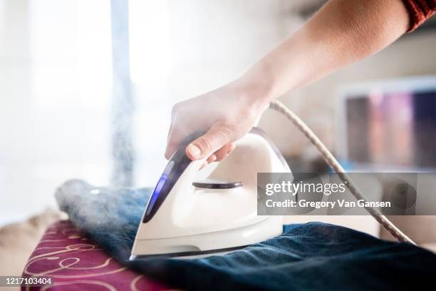 steam ironing - iron stock pictures, royalty-free photos & images