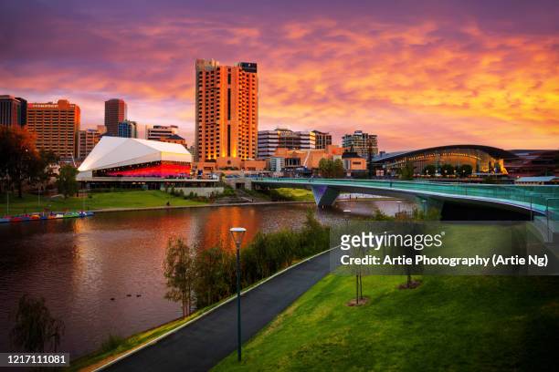 sunset view of elder park, the riverside precinct and the torrens lake, adelaide, south australia - adelaide stock pictures, royalty-free photos & images