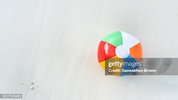 close up looking down view of beach ball in maldives beautiful beach background with white sandy tropical island in summer. copy space - ゴムボール ストックフォトと画像