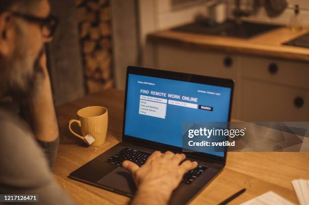 working during isolation period - unemployment benefits stock pictures, royalty-free photos & images