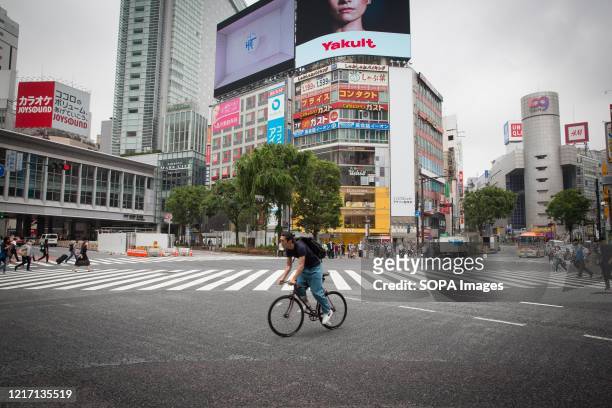 Cyclist rides along the streets during the lifting of the state of emergency. Japan has lifted a state of emergency imposed due to the coronavirus in...