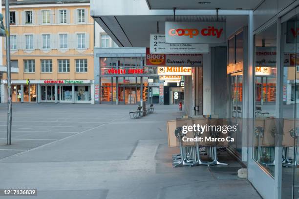tidied up outside seating of a restaurant in a pedestrian zone - lakeside shopping centre stock pictures, royalty-free photos & images
