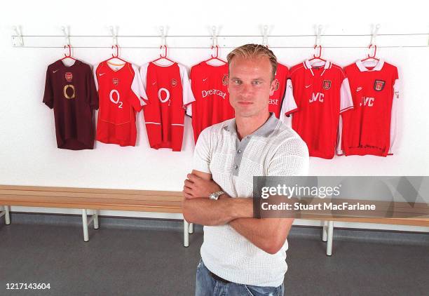 Dennis Bergkamp sits in front of all the Arsenal home shirts he wore at the Arsenal Training Ground on October 11, 2005 in St. Albans, England.