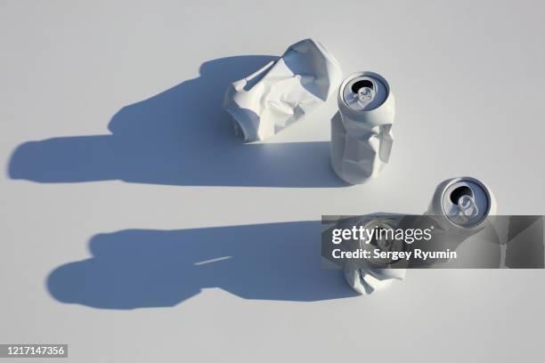 crumpled soda cans with bright shadows - white garbage can stock pictures, royalty-free photos & images