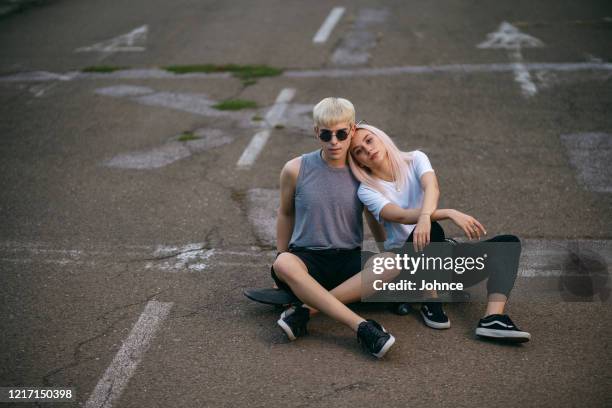 teen skaters hanging out together - modern boy hipster stock pictures, royalty-free photos & images