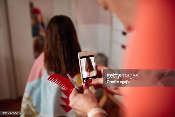 Mother Doing Haircut To Her Daughter During Total Lockdown