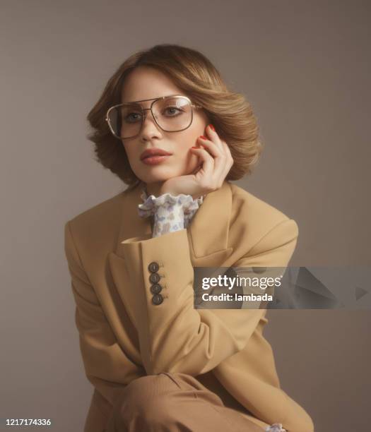 fashionable woman in beige suit, 70s style - 1960s woman stock pictures, royalty-free photos & images