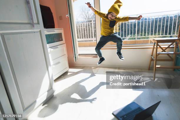 little boy dancing break at home. home pleasures. e-learning - kid dancing stock pictures, royalty-free photos & images