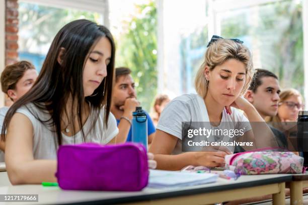 students take notes in the classroom - pencil case stock pictures, royalty-free photos & images