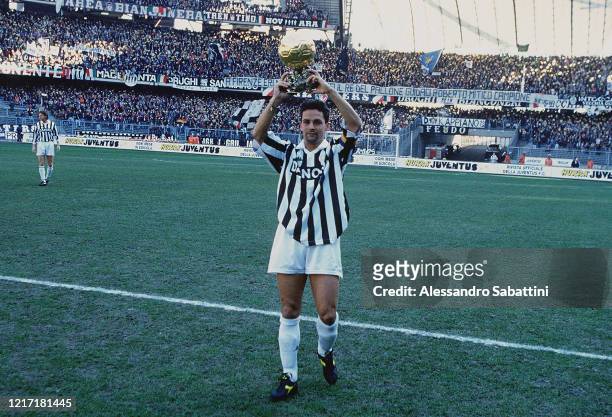 Roberto Baggio of Juventus celebrates in Turin after winning the golden ball during the Serie A on Stadio Delle Alpi in Torino, Italy.