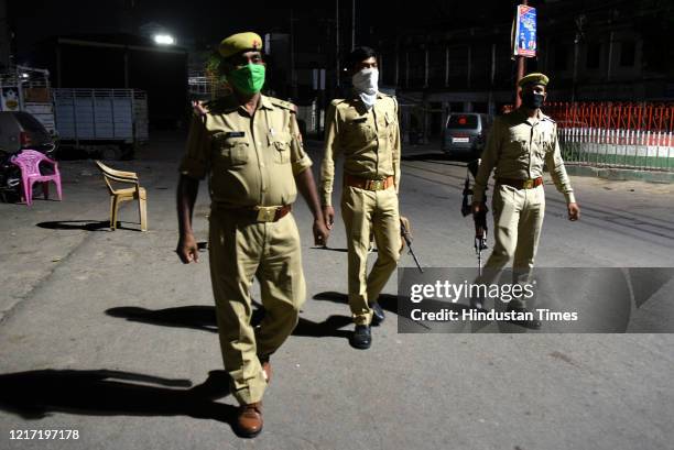 Police personnel on patrol during night curfew at Tandon Chauraha on June 1, 2020 in Lucknow, India.