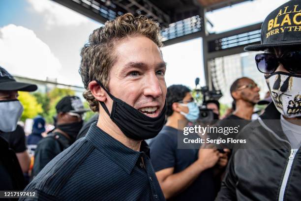 Pastor Joel Osteen arrives before a march in honor of George Floyd on June 2, 2020 in Houston, Texas. Members of George Floyd's family participated...