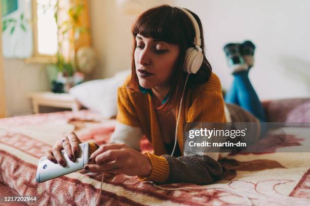 staying home during covid-19 pandemic - staying indoors stock pictures, royalty-free photos & images