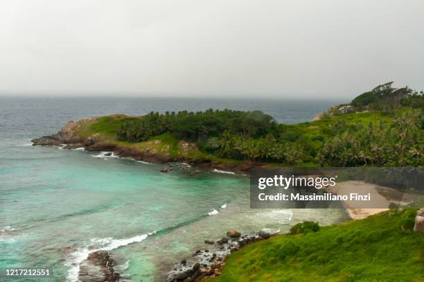 remote bay in a tropical island. fregate island, seychelles - fregate stock pictures, royalty-free photos & images