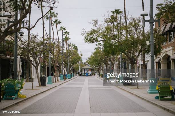 An empty Third Street Promenade is seen during the COVID-19 "shelter-in- place" mandate on March 19, 2020 in Los Angeles, California. The coronavirus...