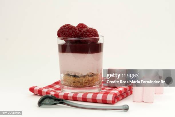 homemade mousse fruits of the forest in jar with rasperry over white background. copy space. - gooseberry cake stock pictures, royalty-free photos & images