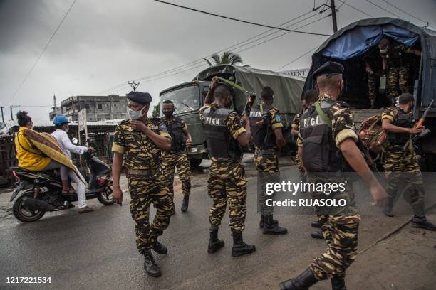 Soldiers form the Malagasy Gendarmerie patrol the streets of Toamasina, a port city in eastern Madagascar, on June 2 where containment measures have...