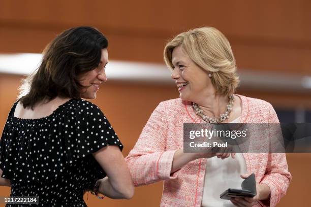 Minister of State Dorothee Bär and Minister of Agriculture Julia Klöckner greet each other with an elbow bump as they arrive for the weekly...