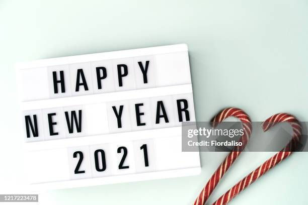 light box inscription happy new year 2021on pastel blue background - lightbox stock pictures, royalty-free photos & images