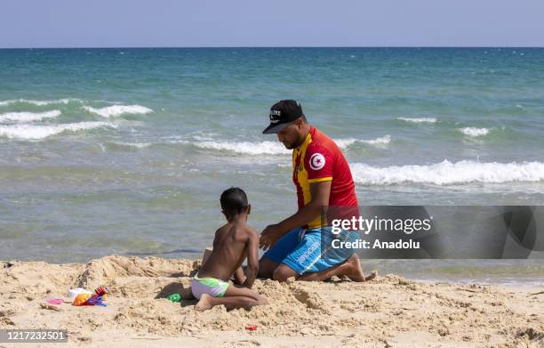 People enjoy the beach on a sunny day as Tunisia lifts more coronavirus restrictions in Hammamet, Tunisia on June 2, 2020. Tunisia will open its sea,...