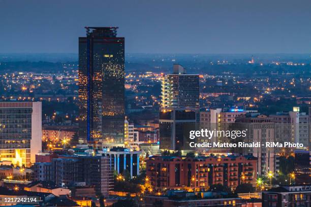 palazzi di brescia 2 - brescia skyscrapers by night - brescia stock pictures, royalty-free photos & images