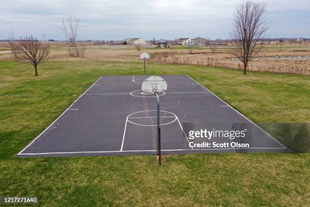 An aerial view from a drone shows an empty playground on April 06, 2020 in Hebron, Illinois. The governor ordered residents to shelter-in-place in an...