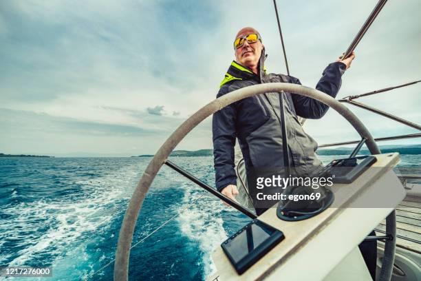 adventure man sailing on aadriatic sea - team captain stock pictures, royalty-free photos & images