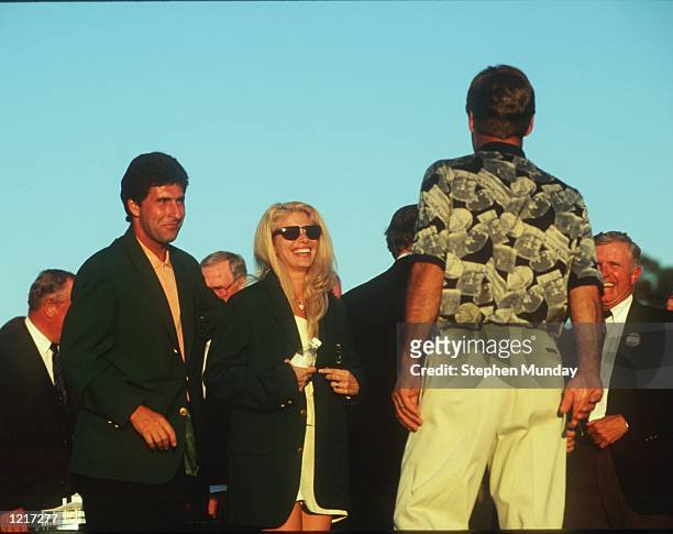 S WIFE JULIE TRIES ON HIS GREEN JACKET AFTER HE WINS THE 1995 US MASTERS GOLF CHAMPIONSHIP AT THE AUGUSTA NATIONAL GOLF COURSE IN AUGUSTA, GEORGIA....