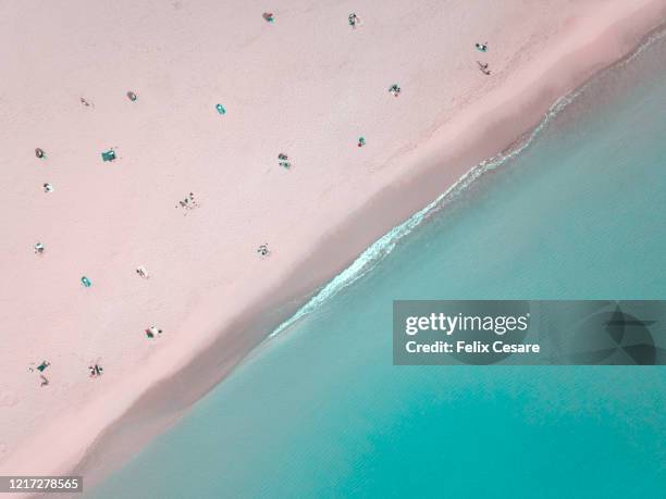 aerial view of people social distancing at the beach - queensland coronavirus stock pictures, royalty-free photos & images