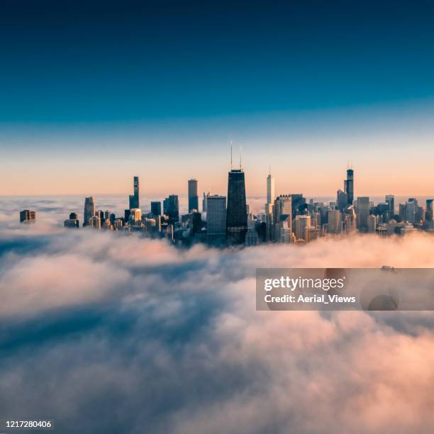 dramatic view of chicago wrapped by fog - 4k resolution stock pictures, royalty-free photos & images