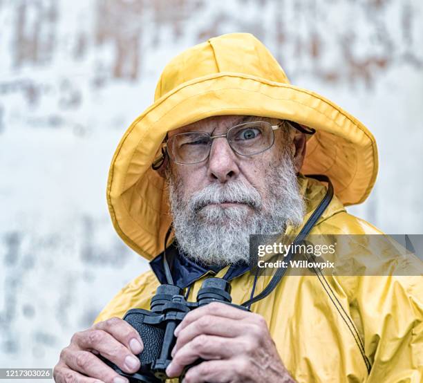 yellow raincoat ancient mariner popeye facial expression - rain hat stock pictures, royalty-free photos & images